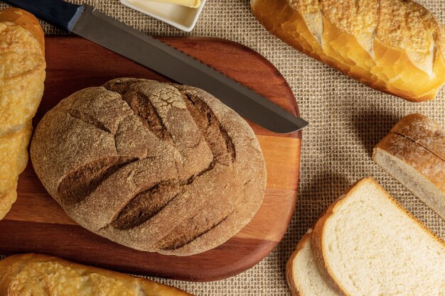 Premium Photo A Mix Of Different Types Of Breads On The Table 3316