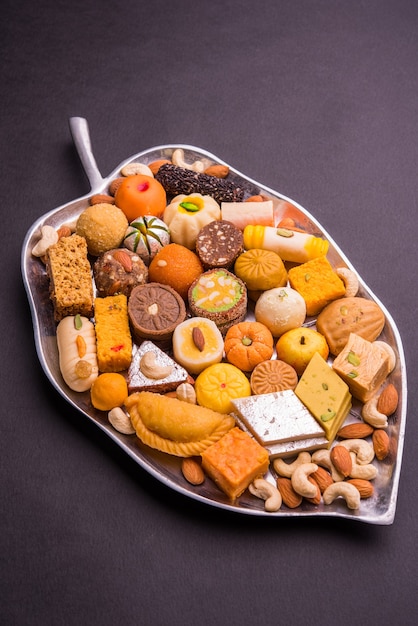 Premium Photo | Mix mithai or milk made sweets of indian and pakistani ...