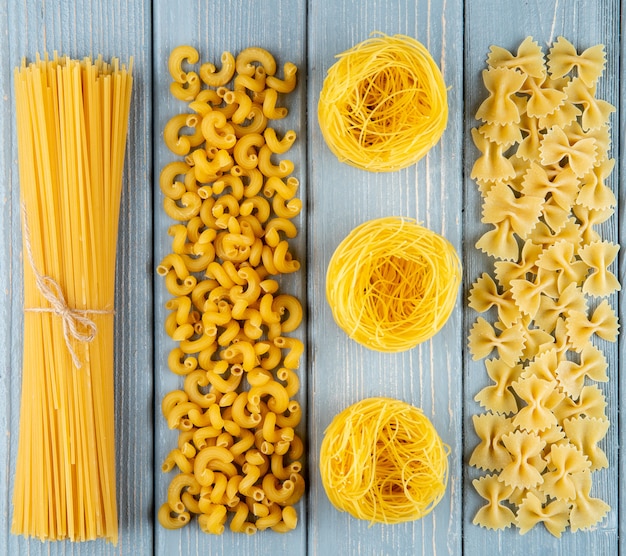 Free Photo | Mix pastas spaghetti chifferi tagliolini farfalle top view