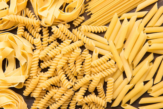 Premium Photo | Mixed dried italian pasta collection. dry pasta background