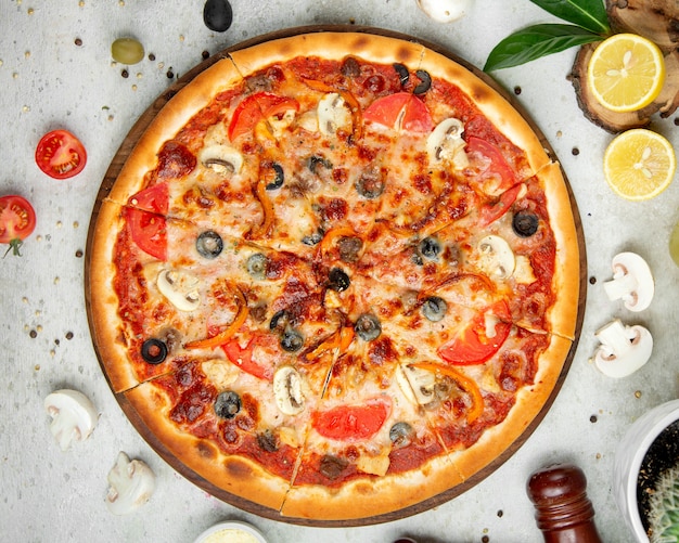 Mixed pizza with sliced lemon Photo | Free Download