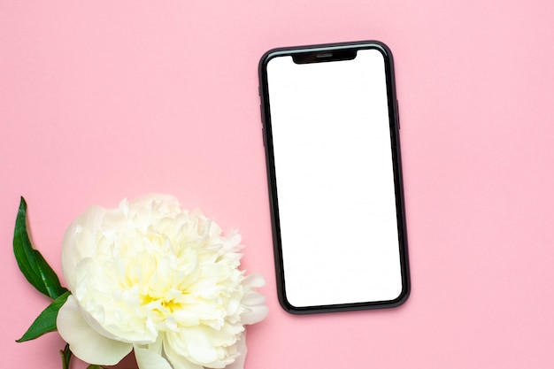 Mobile Phone Mock Up And Peony Flower On Pink Pastel Table Woman