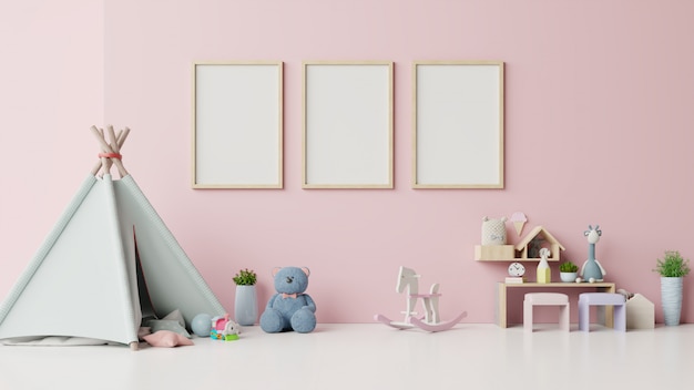 プレミアム写真 ピンクの背景の子供部屋のインテリアにポスターのモックアップします