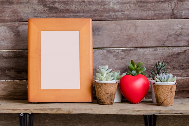 Download Mock up wooden frame on shelf with valentine heart and ...
