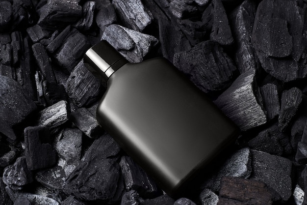 Download Premium Photo Mockup Of Black Fragrance Perfume Bottle Mockup On Dark Coals Background Top View Horizontal