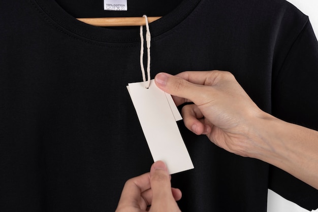 Mockup blank black t-shirt and blank label tag for ...