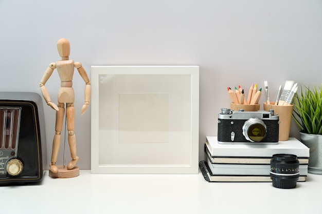 Download Premium Photo Mockup Blank Poster Books Vintage Radio And Vintage Camera On Workspace Desk Yellowimages Mockups