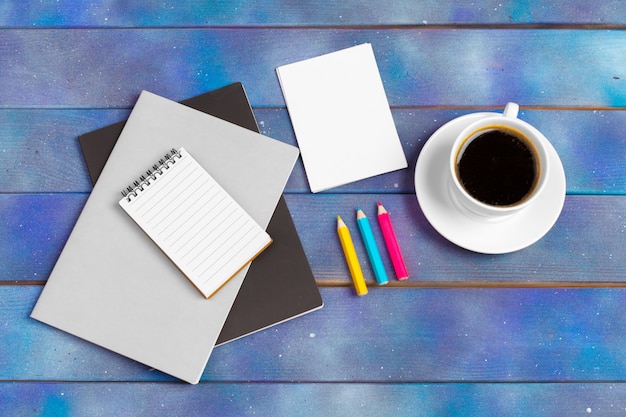 premium-photo-mockup-for-check-list-empty-note-paper-with-coffee-cup-on-blue-wood-office