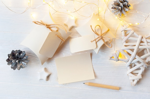 Download Mockup christmas kraft gift boxes with tag on wooden ...