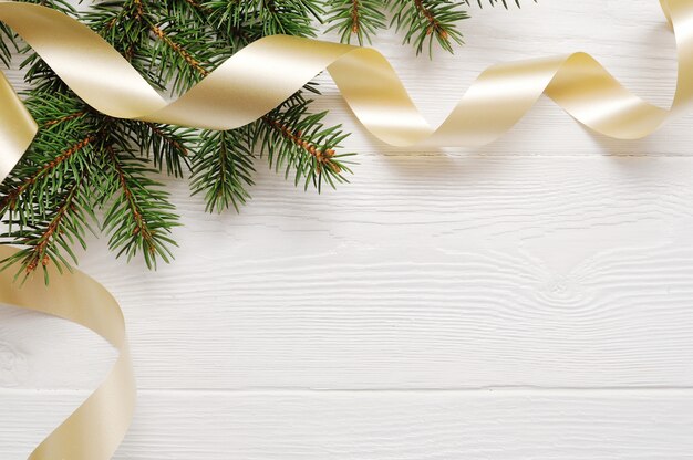 Download Mockup christmas tree and gold ribbon, flatlay on a white ...