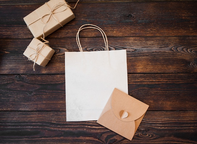 Download Premium Photo | Mockup kraft gift boxes with package on wood