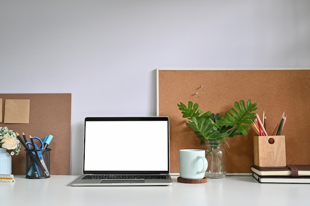 Premium Photo | Mockup laptop computer on workspace and office supplies.