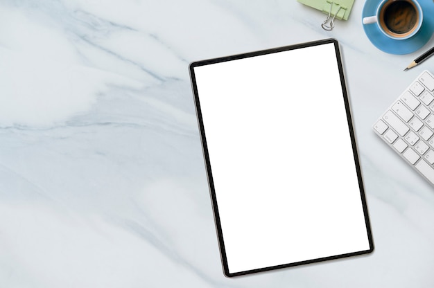 Premium Photo | Mockup tablet with blank screen on white marble table.