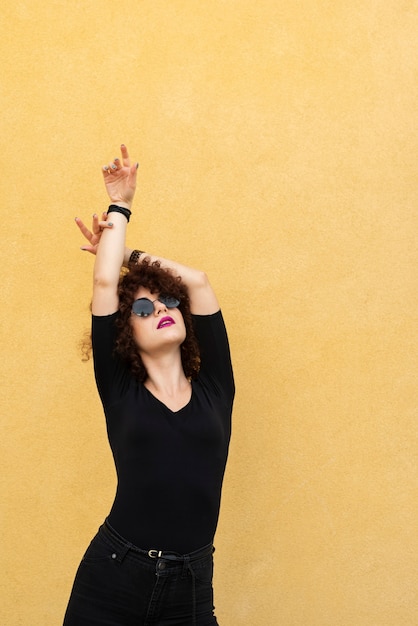 Model posing on plain background | Free Photo