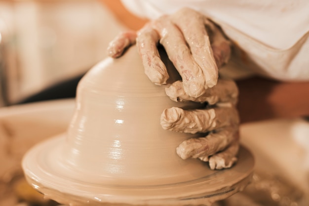 Free Photo | Modeling of clay on a potter's wheel in the pottery workshop