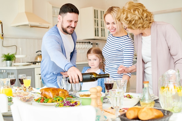 Premium Photo | Modern family setting dinner table for party