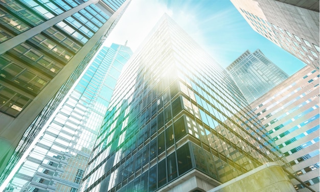 Premium Photo | Modern office glass buildings over sky background