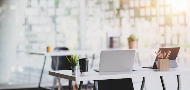 Premium Photo | Modern office with office supplies on table with office  environment in the background