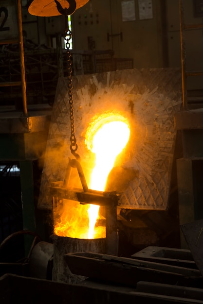 Premium Photo | Molten iron molten metal poured in to ladle