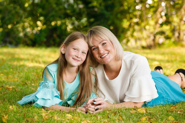 Premium Photo Mom Blonde With Daughter In The Park In Summer In Sunny Weather 