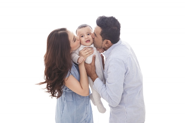 Premium Photo Mom And Dad Kissing Their Cute Baby