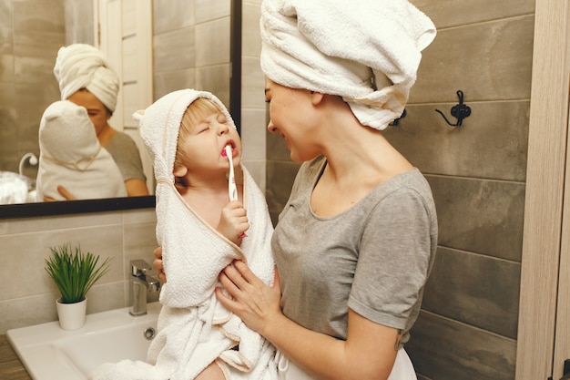 Mom Teaches Little Son To Brush His Teeth Photo Free Download