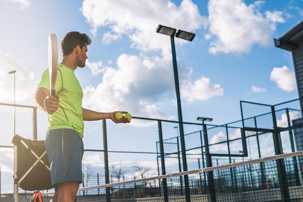 Premium Photo | Monitor teaching padel class