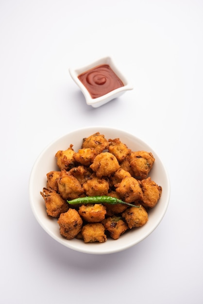 Premium Photo | Moong dal vada or mungode pakoda, dalwada, pakora or ...