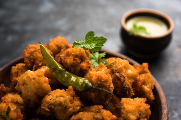 Premium Photo | Moong dal vada or pakoda also known as moongode served ...