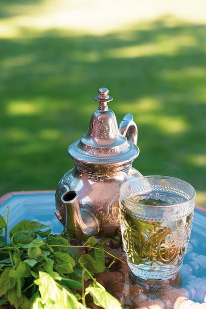 Premium Photo | Moroccan cold green herbal tea on a traditional tray