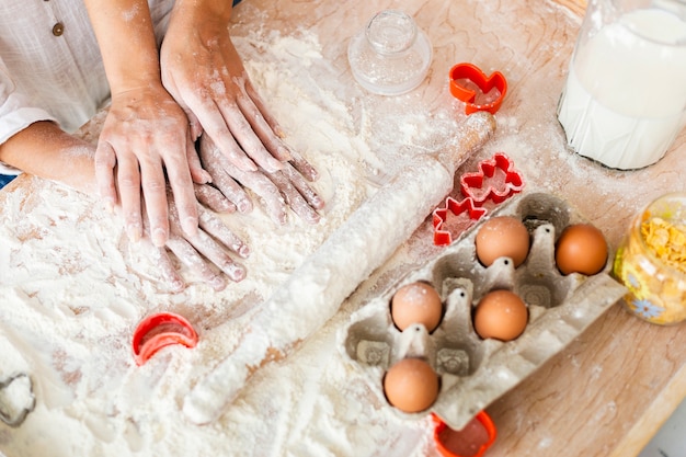 Mother and daughter hands making a dough Free Photo