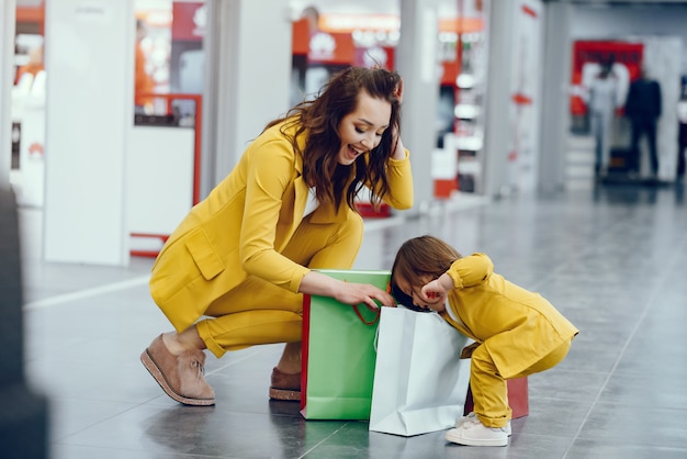 Mother and daughter with shopping bag Free Photo