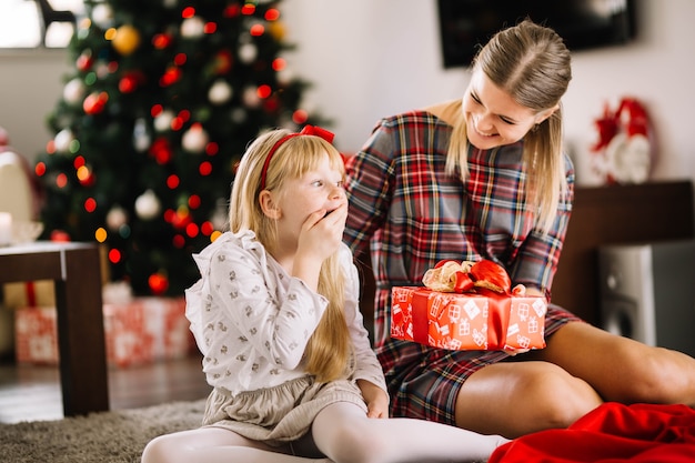 Free Photo | Mother giving present to daughter