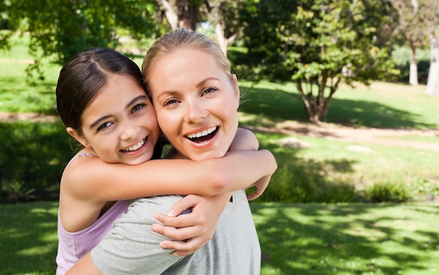 Premium Photo Mother And Her Daughter Laughting In The Park