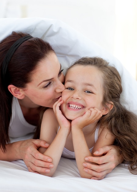 Premium Photo Mother Kissing Her Daughter