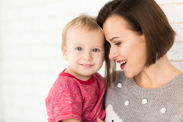 Free Photo | Mother smiling at baby