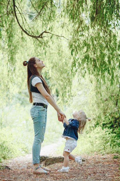 Download Mother standing holding her daughter's hands Photo | Free ...