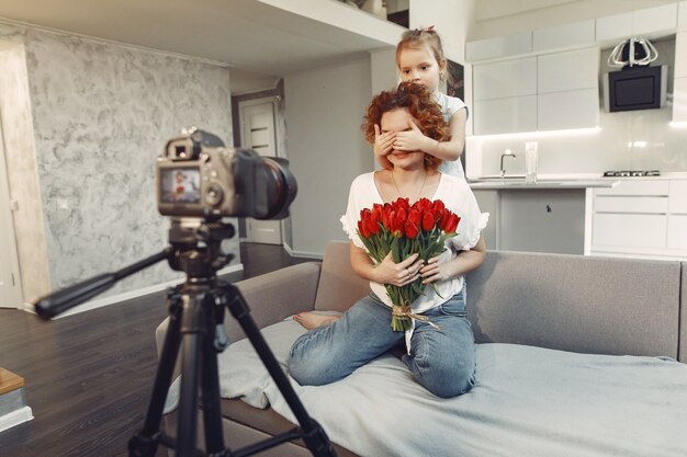 Mother with daughter shoots a blog at home | Free Photo