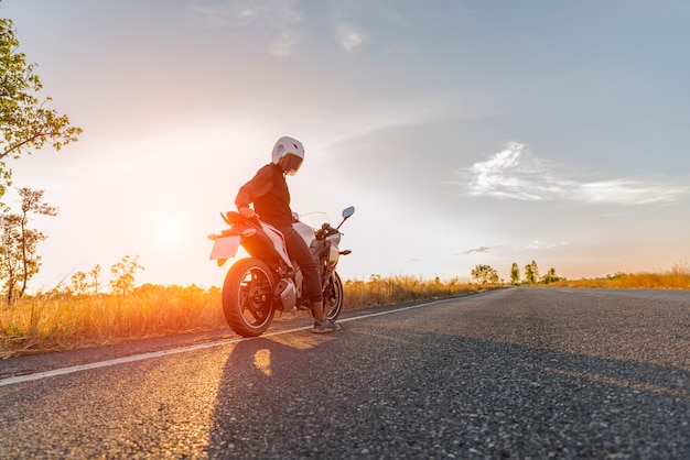 Premium Photo | Motorcycle on sunset