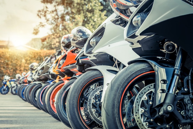 Motorcycles group parking on city street in summer Premium Photo