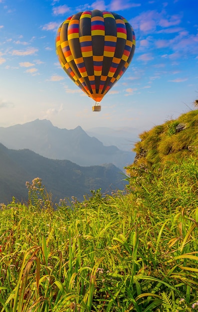 Premium Photo | Mountain scenery with hot air balloons and beautiful sky