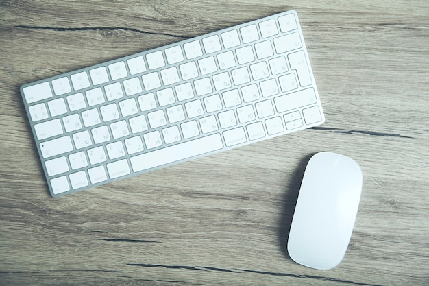 Premium Photo | Mouse and keyboard on wooden background