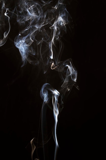Movement Of Faded Smoke On Black Background Photo Free
