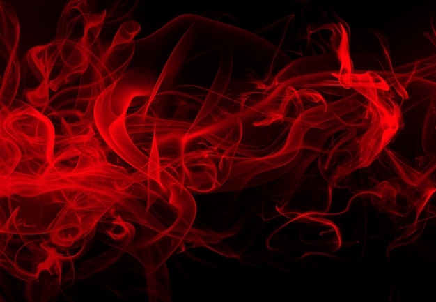 Premium Photo | Movement of red smoke abstract on black background