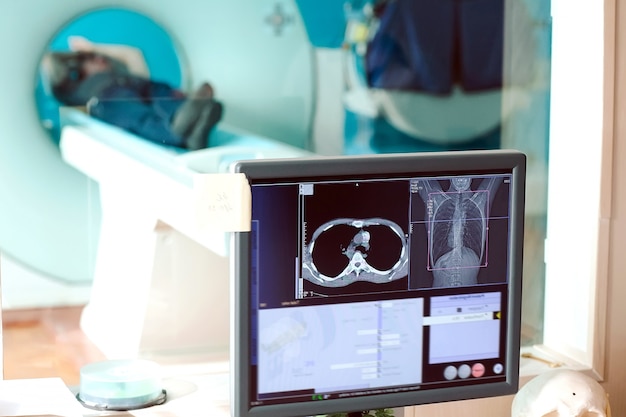 Mri machine and screens with doctor and nurse Premium Photo