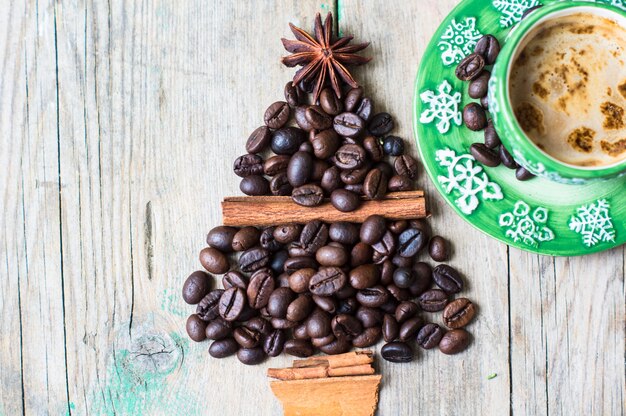 Premium Photo | Mug of coffee and beans as a holiday christmas concept