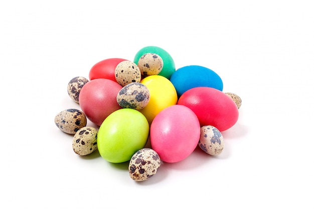 Premium Photo | Multi-colored easter eggs lie on a white background ...