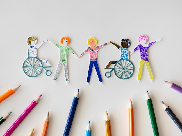 Multi-ethnic and disabled people community with pencils Free Photo