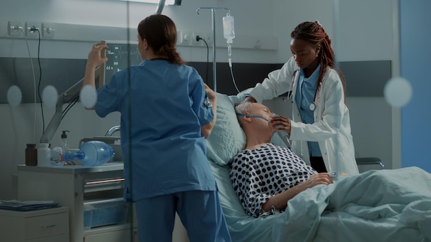 Premium Photo | Multi ethnic medical staff running to help ill patient ...