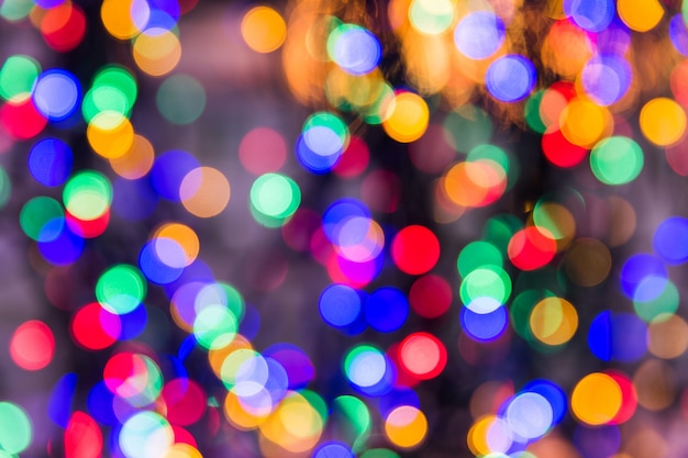 Premium Photo | Multicolored lights bokeh texture. christmas lights blured